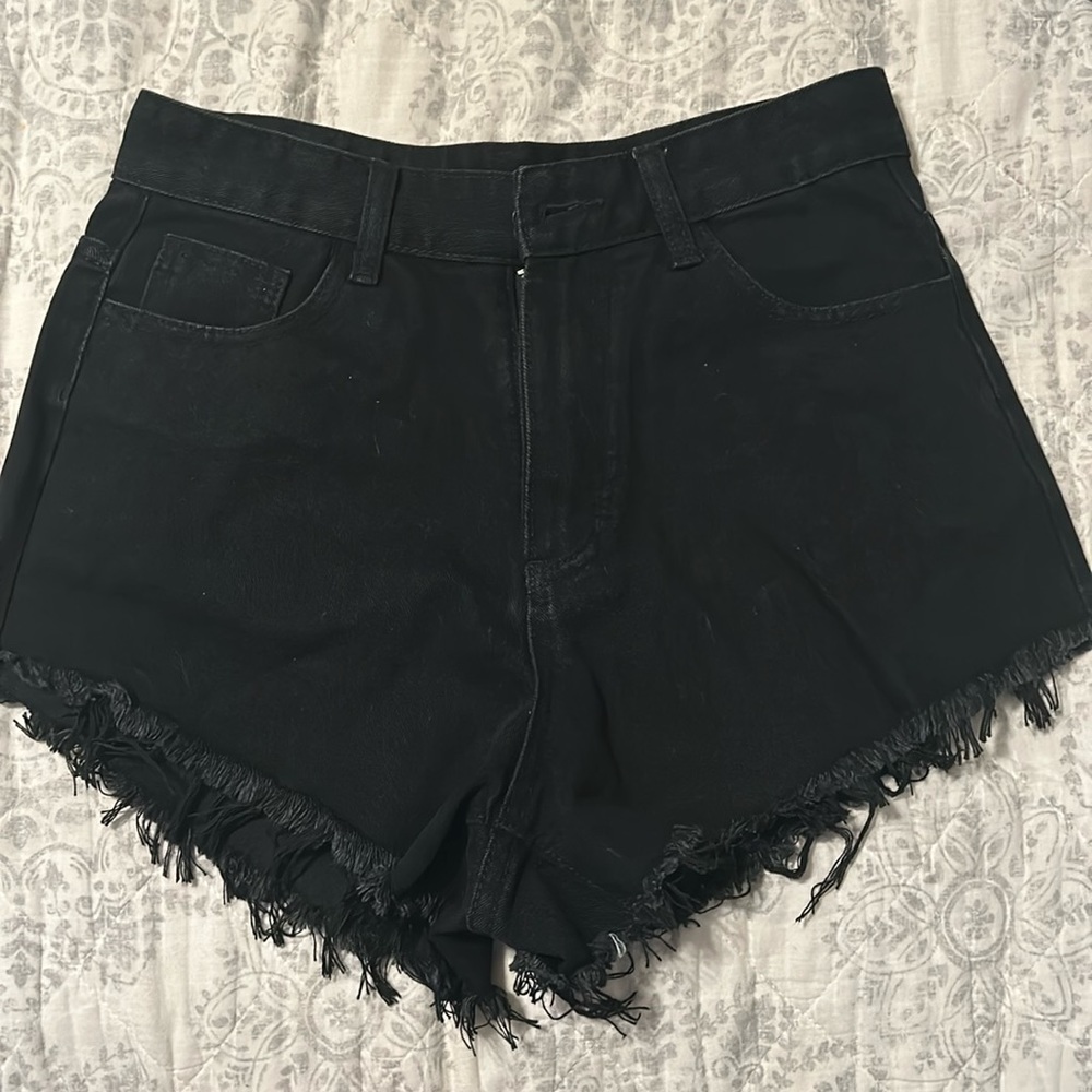 Black jean shorts never worn with flame on pockets. Size Medium Us 6